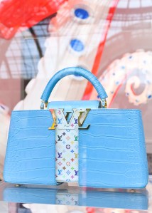 The Louis Vuitton stand at Art Basel Paris featuring artworks and handbag designs by Takashi Murakami.