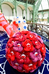 The Louis Vuitton stand at Art Basel Paris featuring artworks and handbag designs by Takashi Murakami.