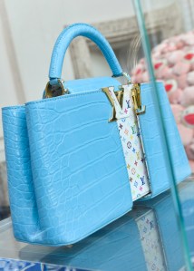 The Louis Vuitton stand at Art Basel Paris featuring artworks and handbag designs by Takashi Murakami.