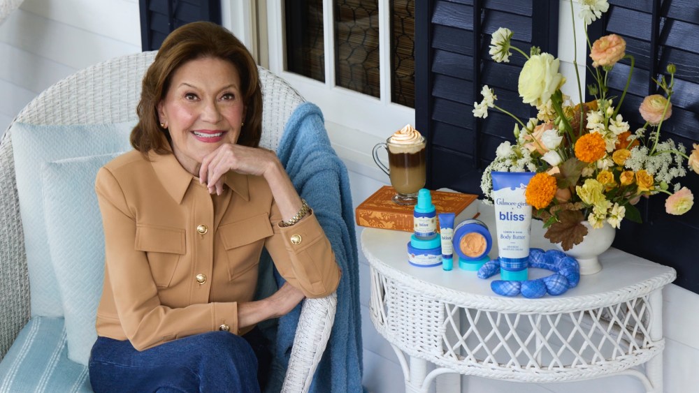 Kelly Bishop next to the Bliss x "Gilmore Girls" collection.