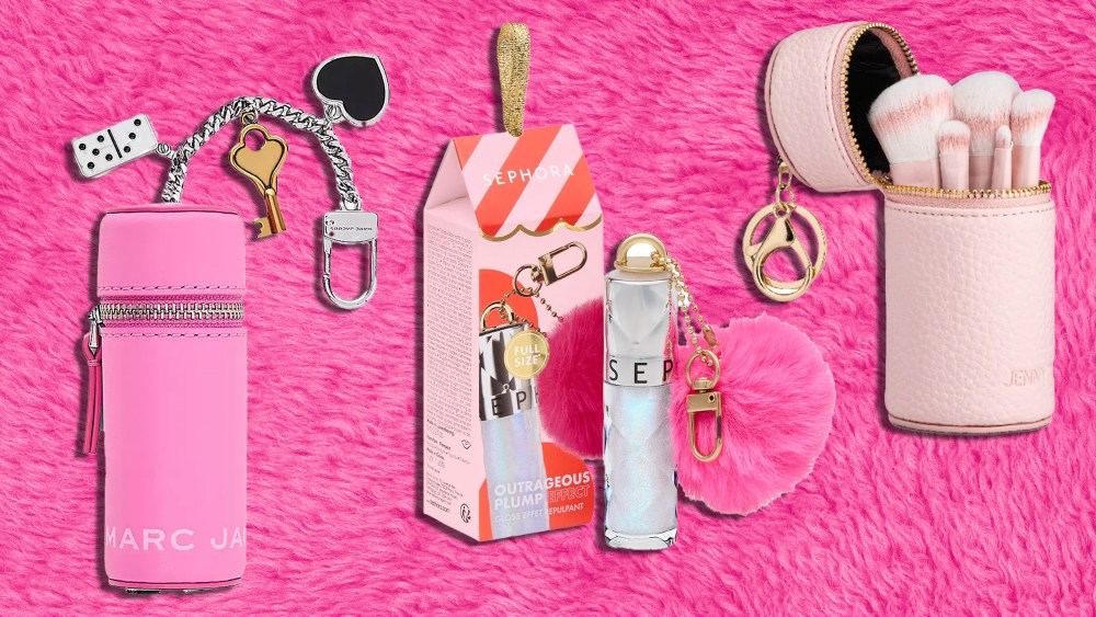 assortment of pink beauty bag charms over a fuzzy pink background
