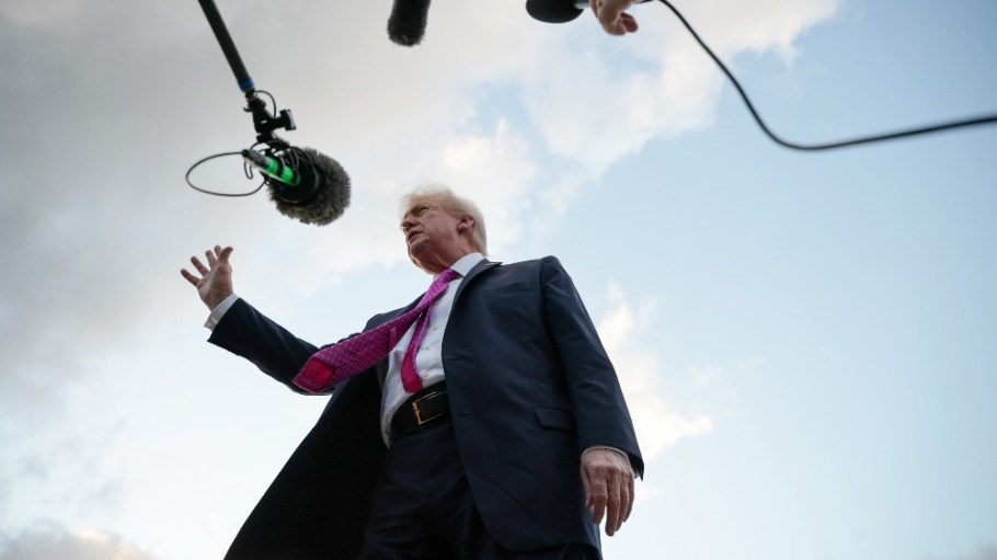 U.S. President Donald Trump speaks to members of the press after he landed at West Palm Beach International Airport on Oct. 17.