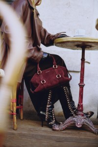 McQueen calf leather Farringdon bag; Loewe leather jacket and Ferragamo silk and cashmere dress; Thomasine lambskin gloves; Dries Van Noten boots.