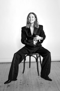 Givenchy by Sarah Burton wool cocoon jacket and trousers; Khaite shoes; Walter’s Faith 18-karat yellow gold and diamond earrings; Movado Heritage 1917 stainless steel watch with cherry leather strap.