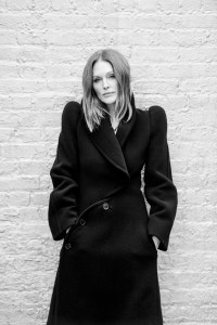 Alaïa curved wool coat; Khaite boots; Tiffany & Co. Elsa Peretti Snake necklace in yellow gold.
