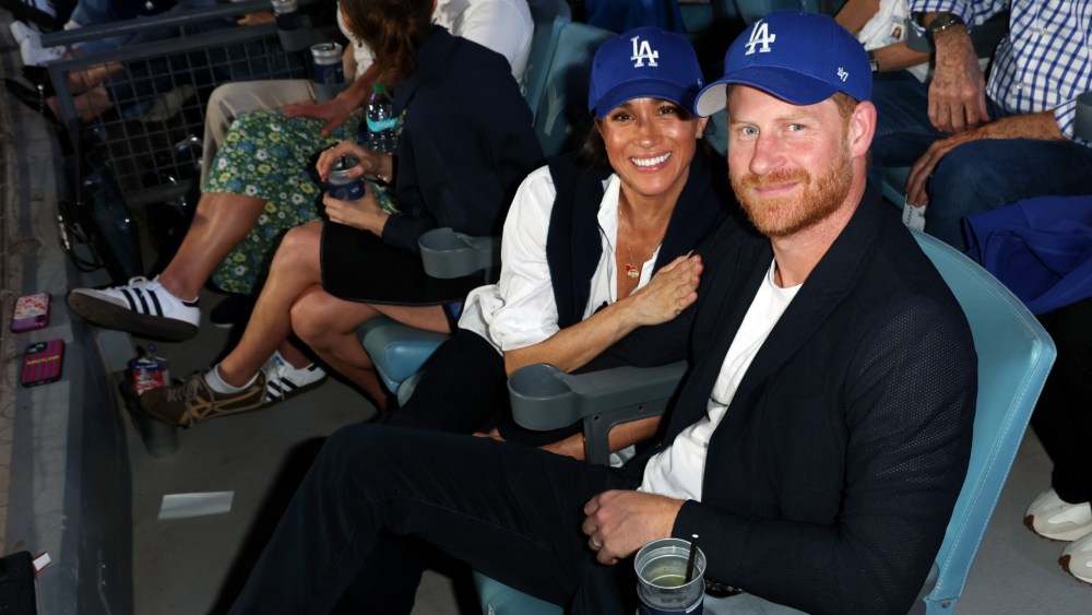 Meghan Markle wears pieces by Givenchy, Veronica Beard, Brochu Walker and more alongside Prince Harry during Game Four of the 2025 World Series on Oct. 28, 2025 in Los Angeles.