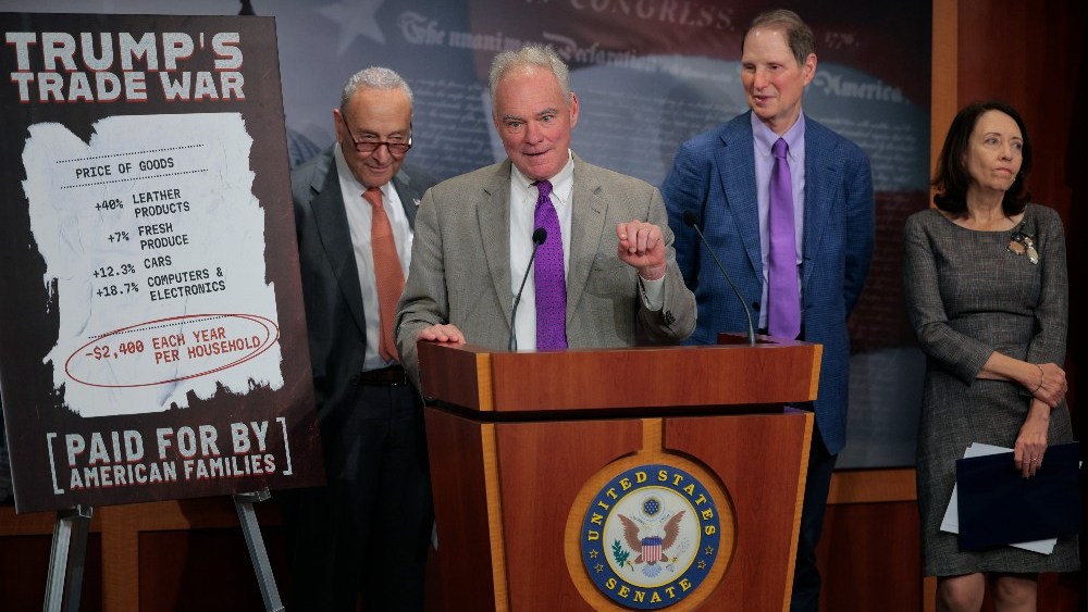 Senate Minority Leader Chuck Schumer, Sen. Tim Kaine, Sen. Ron Wyden and Sen. Maria Cantwell at a news conference criticizing President Donald Trump's trade policy at the U.S. Capitol on July 31.