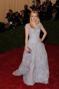 Dakota Fanning attends the Metropolitan Museum of Art&acirc;&euro;&trade;s 2012 Costume Institute Gala featuring the debut of &acirc;&euro;&oelig;Schiaparelli and Prada: Impossible Conversations.&acirc;&euro;� Fanning wears Louis Vuitton with Fred Leighton jewelry and Louis Vuitton clutch.