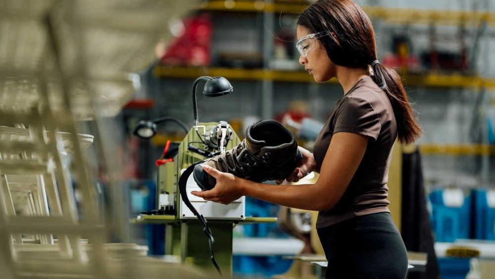 Worker makes boots inside Keen's new factory in Shepherdsville, Kentucky