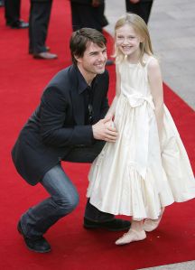 LONDON - JUNE 19:  Actor Tom Cruise and actress Dakota Fanning arrive at the UK premiere of "War Of The Worlds" at the Odeon Leicester Square June 19, 2005 in London, England.  (Photo by MJ Kim/Getty Images)