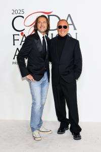 Lance LePere and Michael Kors at the 2025 CFDA Fashion Awards held at The American Museum of Natural History on November 03, 2025 in New York, New York.