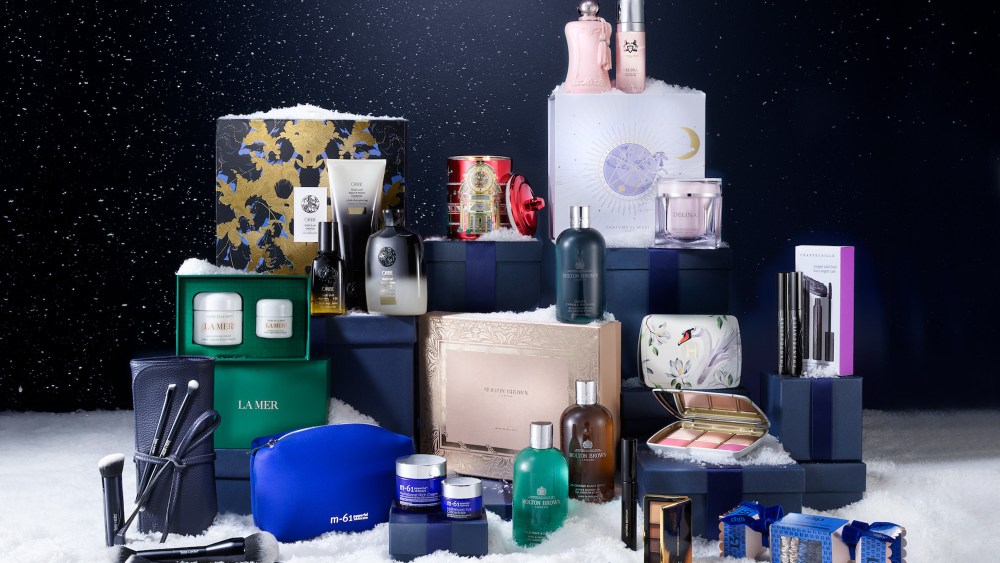 a wide selection of bluemercury beauty sets and holiday gifts arranged in close proximity on a snowy surface
