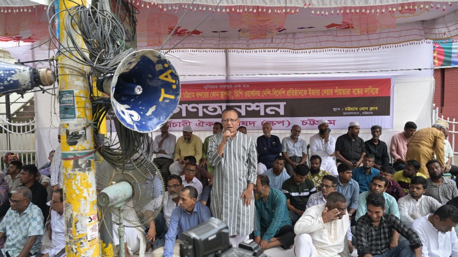 Port workers take part in a hunger strike in front of the Chittagong Press Club on November 1, 2025, protesting the interim Bangladesh government's decision to lease operating licenses at Chattogram Port to foreign companies.