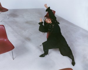 Noir Kei Ninomiya faux leather harness and polyester shirt; Issey Miyake wool pants; Balenciaga boots; Tiffany & Co. Bird on a Rock by Tiffany ring in platinum and yellow gold with rubellite, diamonds and rubies.