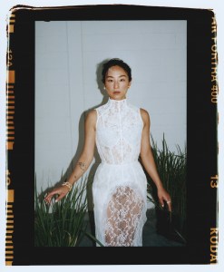 Acne Studios cotton and nylon lace dress; Tiffany & Co. Jean Schlumberger by Tiffany Multiplication ear clips in yellow gold and platinum and diamond bracelet; Tiffany & Co. Rope six-row X diamond ring in yellow gold and platinum.