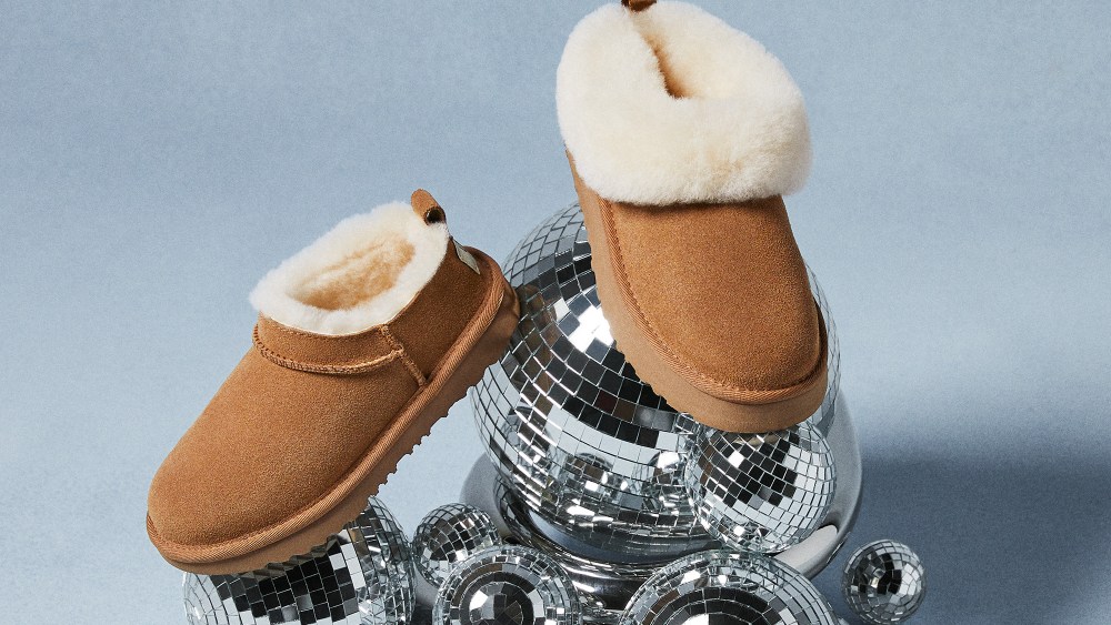 two distinct ugg boot varieties resting on a stack of disco balls