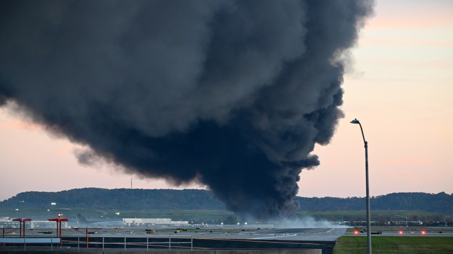 Fire and smoke mark where a UPS cargo plane crashed near Louisville Muhammad Ali International Airport on November 04, 2025 in Louisville, Kentucky. The fully fueled plane crashed shortly after takeoff with a shelter-in-place order issued for within five miles of the airport.