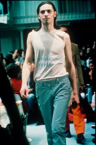 Sleeveless printed t-shirt worn with pale blue trousers in the Helmut Lang Fall/Winter 1994 show in Paris