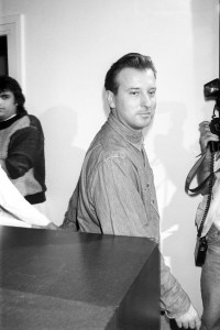 Fashion designer Helmut Lang on the runway during the finale of his spring 1987 ready to wear collection on October 20, 1986 in Paris, France. Article title: "Paris: The Young Coquettes"