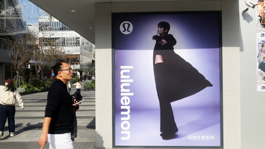 Pedestrians pass by a Lululemon fashion flagship store in Shanghai, China on December 10, 2025.