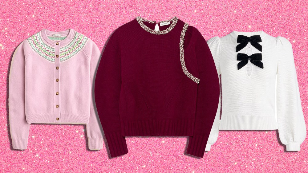 three distinct holiday sweaters lined up over a glittery pink background