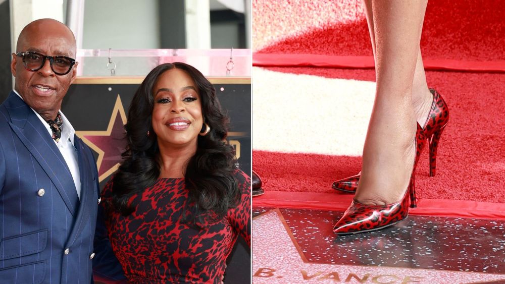 Niecy Nash-Betts wears Stuart Weitzman red leopard print pumps at Courtney B. Vance's Hollywood Walk of Fame star ceremony on Tuesday.