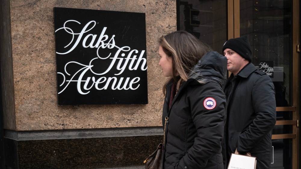 Pedestrians walk past a Saks Fifth Avenue store on December 30, 2025 in Chicago, Illinois. Recent reports indicate that Saks Global Enterprises, the parent corporation of Saks Fifth Avenue, may file for Chapter 11 bankruptcy as they face a more than $100 million debt payment due at the end of December.
