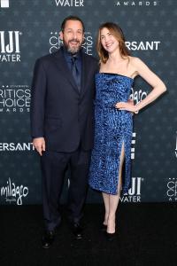 Adam Sandler and Jackie Sandler at the 31st Annual Critics Choice Awards held at Barker Hangar on January 04, 2026 in Santa Monica, California.