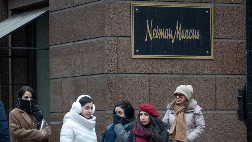 Pedestrians walk past a Neiman Marcus store on December 30, 2025 in Chicago, Illinois.