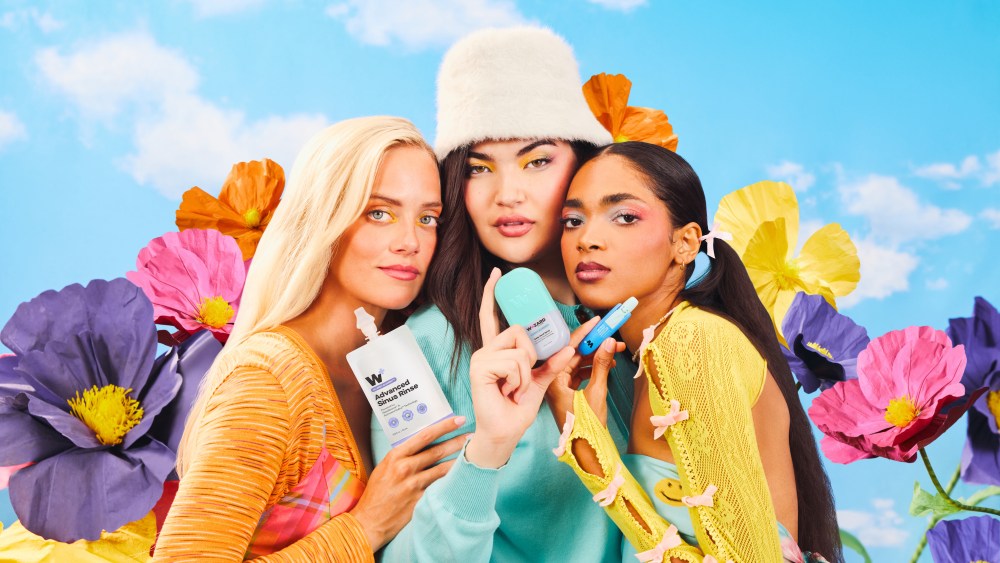 Models holding Wizard Wellness products.