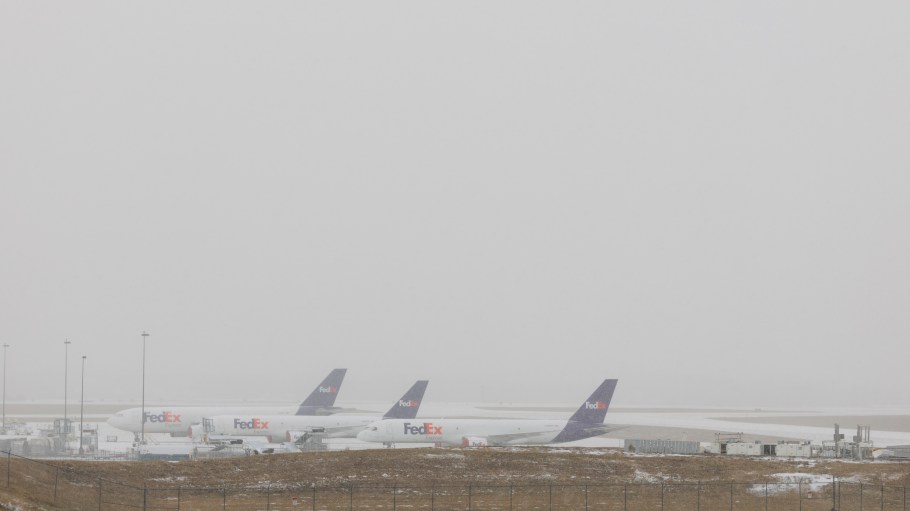 FedEx planes are seen as snow falls at Nashville International Airport on January 24, 2026 in Nashville, Tennessee.