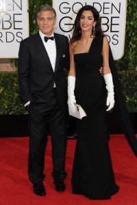 George Clooney and Amal Clooney attend the 2015 Golden Globe Awards at the Beverly Hilton. George Clooney wears Giorgio Armani and Amal Clooney wears Dior Haute Couture and Harry Winston..