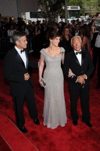 Actor George Clooney, actress Julia Roberts and fashion designer Giorgio Armani attend the Metropolitan Museum of Art's annual Costume Institute gala in New York City. Clooney wears Giorgio Armani and Roberts wears Giorgio Armani Prive.