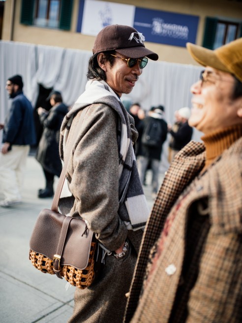 Street style at Pitti Uomo 107 in Florence, Italy, 2025.