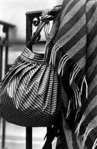 Fendi’s 1989 coated canvas pequin striped shoulder bag and scarf.