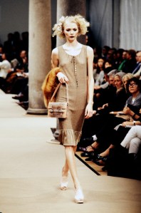 Model Jodie Kidd on the runway at Fendi spring 1997 show carrying a Fendi mini embossed snake skin baguette bag.