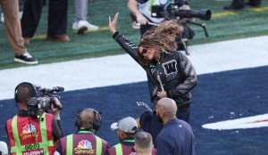 Blue Ivy Carter jumps on the field as she and her father US rapper Jay-Z (off frame) attend Super Bowl LX between the New England Patriots and the Seattle Seahawks at Levi's Stadium in Santa Clara, California on February 8, 2026.