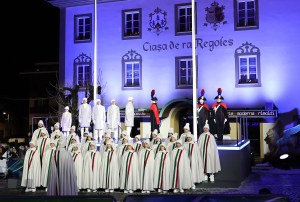 A mountain choir performs the national anthem as the flag of Italy is raised during the opening ceremony of the Milano Cortina 2026 Winter Olympics.