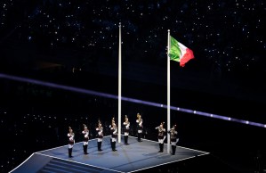 Members of the Corazzieri raise the flag of Italy during the opening ceremony of the Milano Cortina 2026 Winter Olympics.