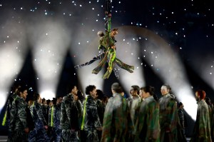 Two aerial actors perform next to the rings representing the city and mountain during the opening ceremony of the Milano Cortina 2026 Winter Olympics at San Siro Stadium on February 06, 2026 in Milan, Italy.
