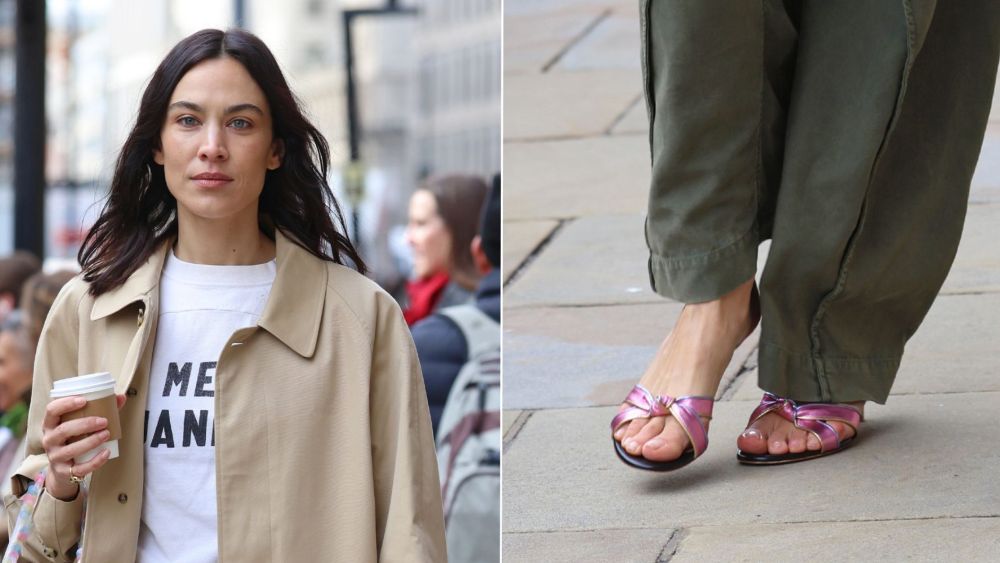 Alexa Chung wearing Malone Souliers Raquel 45 Pink Knotted Metallic Leather Sandal Mules as she attends the label's London Fashion Week showing on Monday.