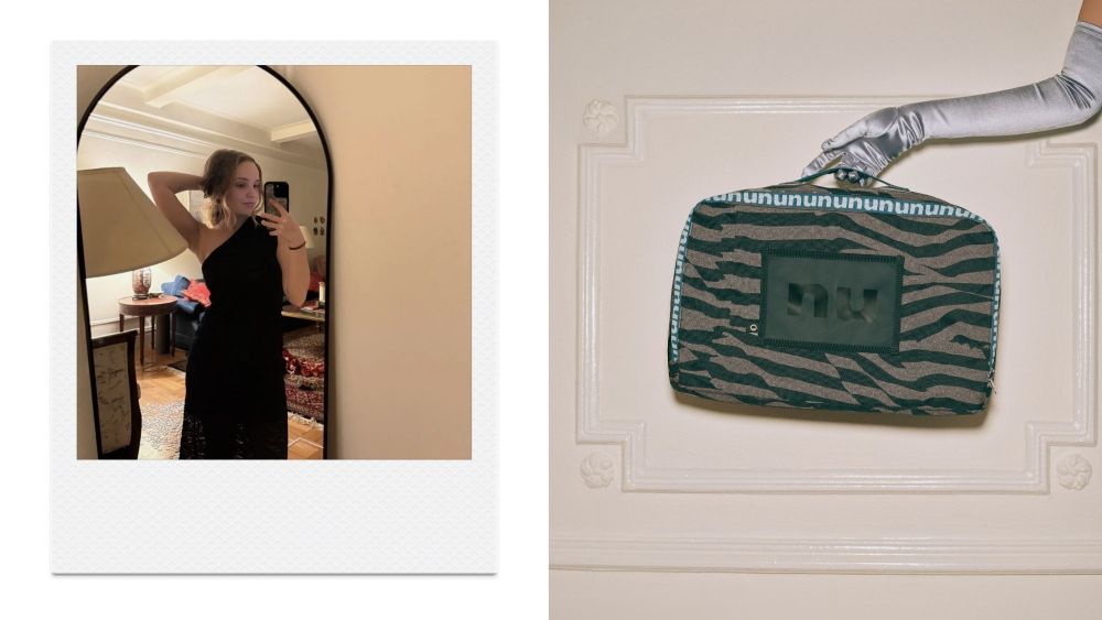 article author testing out a black asymmetrical dress from nuuly while taking a photo in a mirror; hand in glove holding up nuuly clothing bag