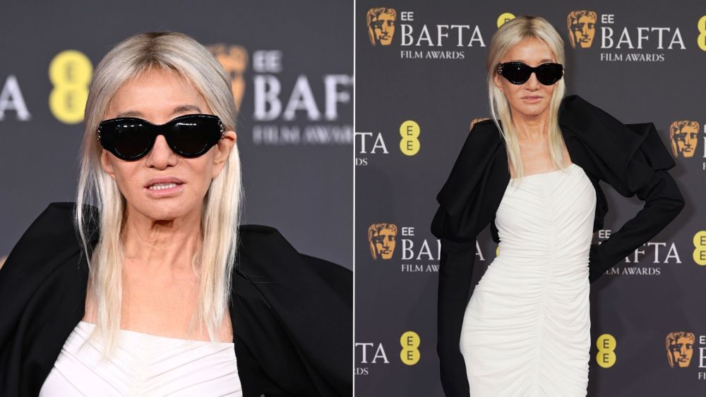 Vera Wang wearing a black and white ensemble, including opera gloves with mitten-like closures, at the 2026 BAFTA Awards on Sunday.