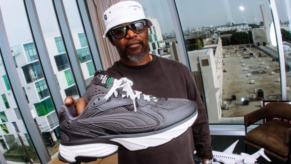 Emory Jones holding his Puma Fade Nitro sneaker.