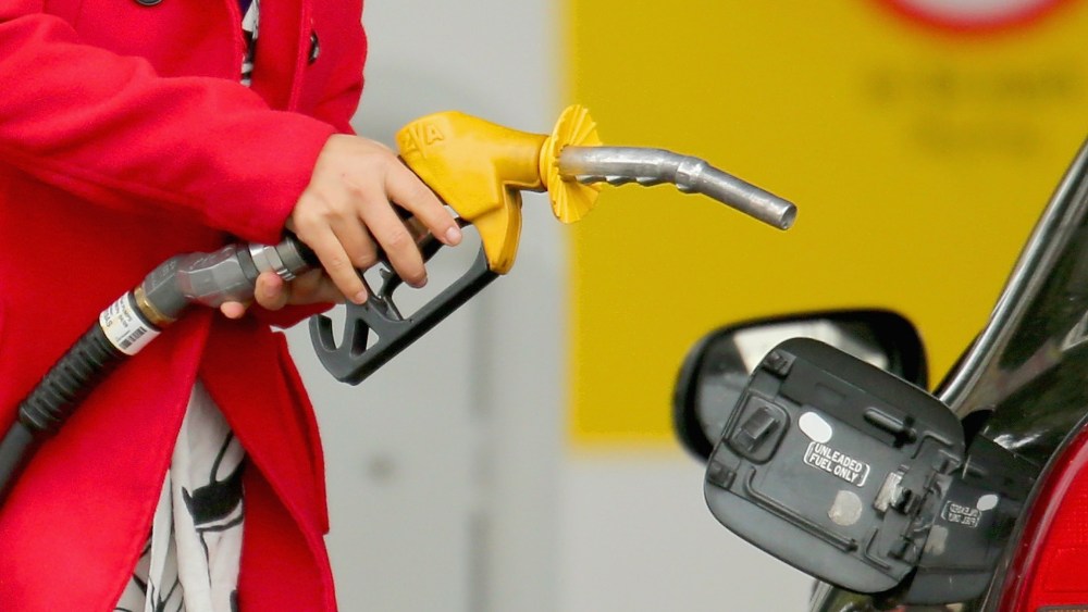 A woman uses a fuel dispenser to fill her car up with petrol at a petrol station on July 23, 2013 in Melbourne, Australia. According to CommSec, fuel prices are expected to rise further as global demand increases and as the weak Australian dollar raises the costs of fuel imports. The average fuel price nationally is at 153.5 cents per litre,  which is reportedly the fastest price increase accross the nation in four years.