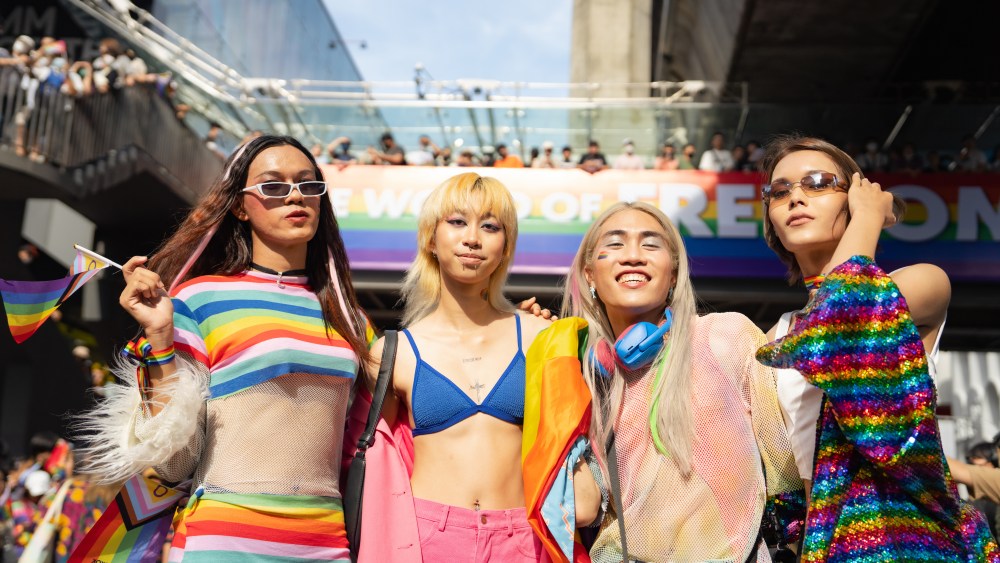 Happy Asian friend having fun in the street LGBTQ pride parade bangkok thailand