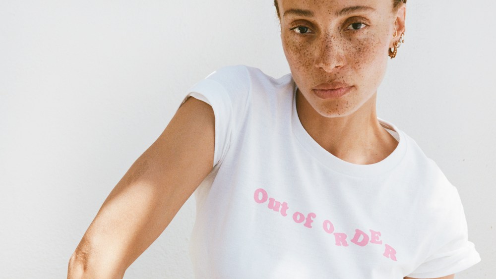 Adwoa Aboah wearing the Cou Cou "Out of Order" slogan t-shirt