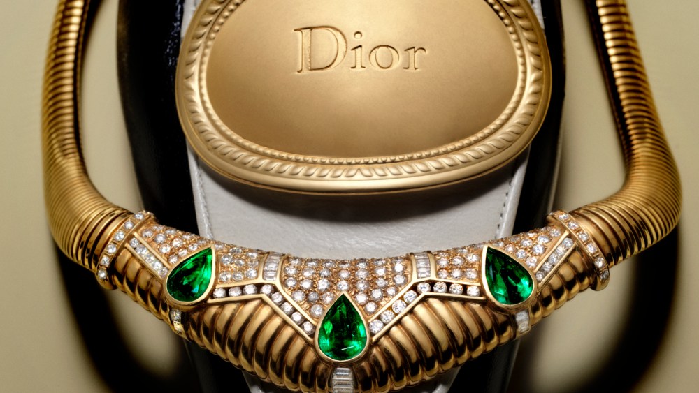 Saidian Vintage Jewels 18-karat yellow gold pear-shaped emerald and diamond necklace; Dior medallion loafer.