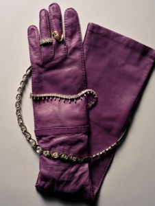 Nikos Koulis Look necklace with emerald-cut white diamonds; Anita Ko Atlas diamond bracelet, marquise and round diamond band, and diamond LouLou locket ring in 18-karat white gold; Prada napa leather gloves.