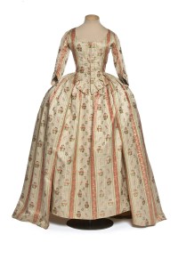 English-style dress, France 1780-1785. White-ground silk Pekin with pink stripes and fine green zigzag stripes, embroidered with floral bouquets in silk threads.